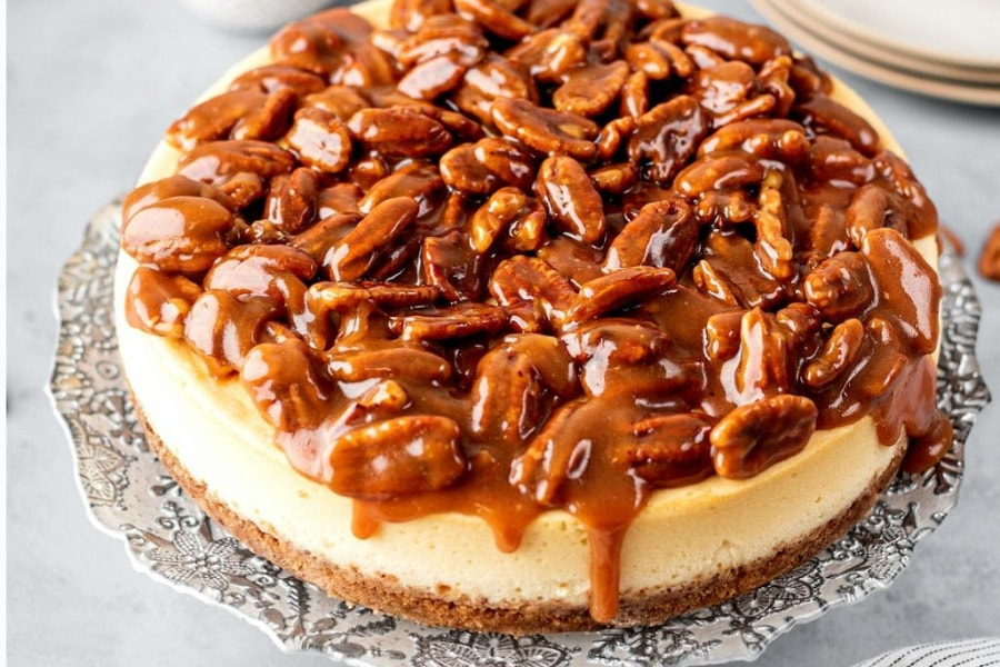 caramel pecan Thanksgiving cheesecake on serving tray