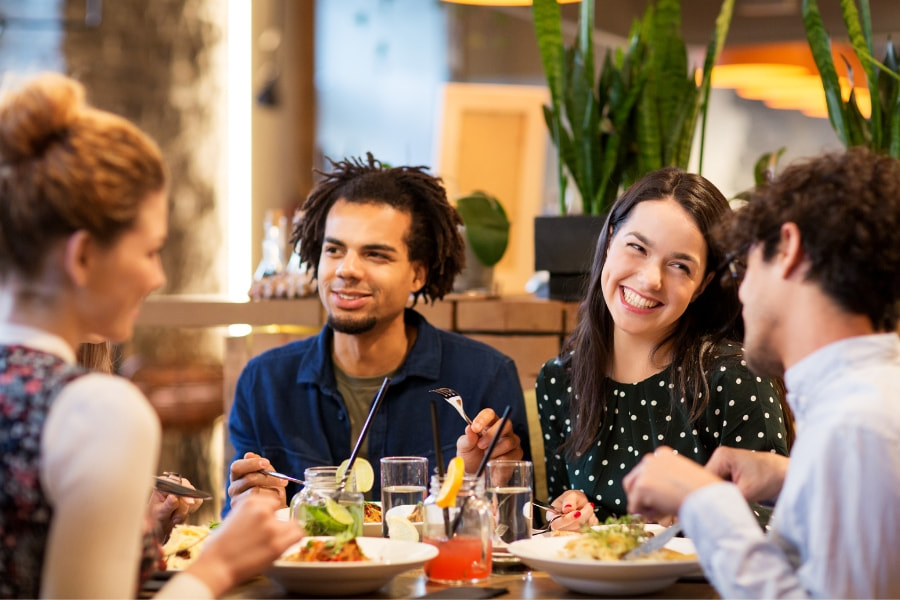 group of friends dining at restaurant 