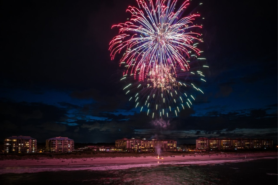 colorful fireworks in the sky over the beach on Amelia Island